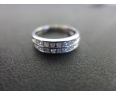 A diamond two-row band ring - Stamped PT 900 - Ring size O - Weight approx 3.4gms
Condition Report: Good - With light surface