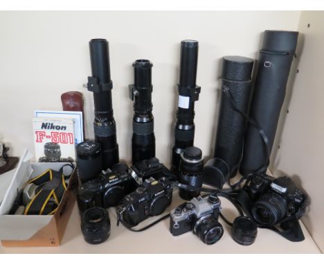 A collection of five camera's, lenses and other photographic items to include three Nikon camera's, one of which F60 is boxed