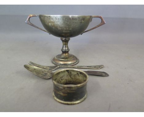 Assorted silver ware - including a cup awarded by Herne Bay bowling club 1933, a fiddle back Georgian spoon, a dessert fork a