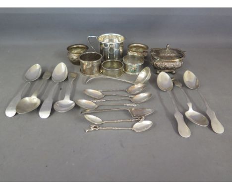 A silver mustard pot and two salts - all without liners, three silver napkin rings, Georgian and later spoons and a small lad