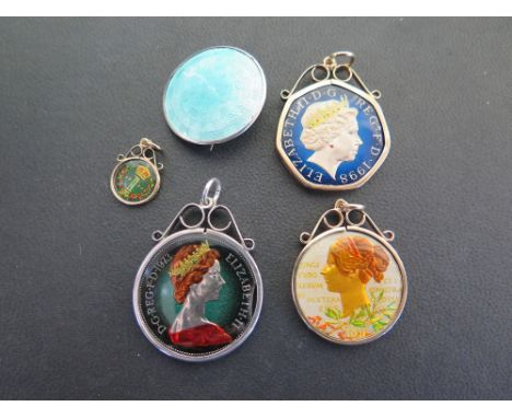 An assortment of four enamel coin pendants - Three within 9ct gold surrounds - Hallmarked Birmingham - Together with a silver