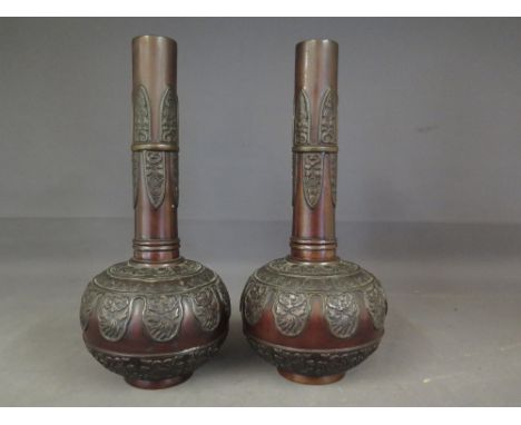 A pair of Oriental ovoid form bronze vases with floral and geometric design 
Condition report: No damage