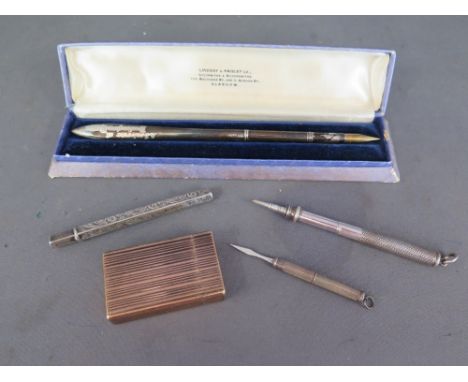 A Mordan & Co silver pencil, a silver tooth pick, a silver pencil holder, a silver dip pen and a gold plated Dupont lighter