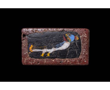 Ca. 100 BC - AD 100. A rectangular glass inlay with a Nilotic bird in profile on a black ground, depicted with an opaque whit