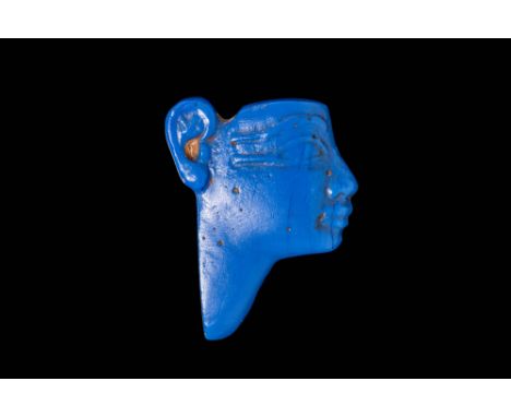 New Kingdom, Ramesside Period, 19th - 20th Dynasty, Ca. 1295 - 1069 BC.An opaque blue glass face inlay, depicting a profile v