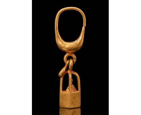 Ca. 700 - 500 BC. A gold earring with a smoothly rounded hoop that widens at the base, where a small suspension loop connects