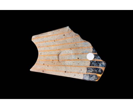 Ptolemaic, Ca. 332 - 30 BC. A fragmentary mosaic glass inlay with parallel stripes forming a feathered pattern running across