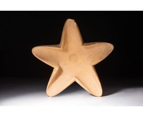 Ca. 2200 - 1500 BC.A rare stone oil lamp in the shape of a five-pointed star with a central circular oil reservoir. The lamp 