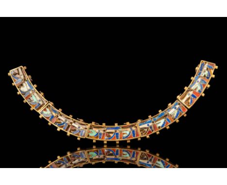 Ca. 664 - 332 BC.A gold necklace composed of five curved rectangular segments, each containing a recessed panel set with mult