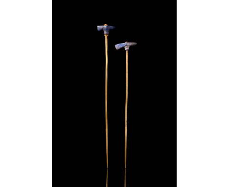 Ca. 2nd millennium BC. A pair of gold pins, each with a long, slender shaft tapering towards a pointed end. The terminals are