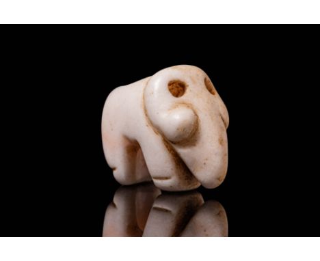 Jemdet Nasr, Ca. 3000 BC. A stone amulet in the form of a stylised elephant, with a compact body and short, rounded legs. The