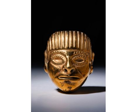 Peru Ca. 100 BC - 100 AD. A gold human head with a rounded form and a slightly pointed chin. The facial features include almo