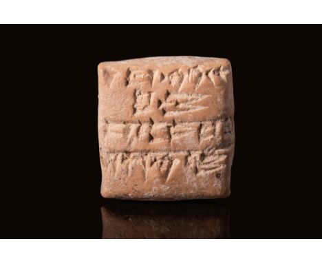 Ca. 3000 - 2500 BC.A pillow-shaped administrative clay tablet. It has many lines of cuneiform on the front and the back.For s