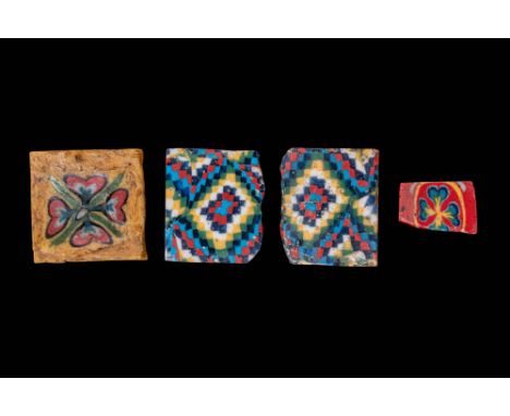 Ca. 100 BC - AD 200. A collection of four square and rectangular mosaic glass inlays with various polychrome designs. The fir