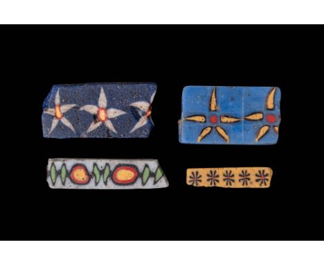 Ca. 332 BC - AD 200. A collection of four rectangular glass inlays with floral and vegetal designs. The one in the left top c