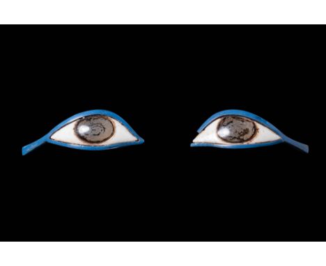 Late Period, Ca. 664 - 332 BC.A pair of glass inlays from an anthropoid coffin, each shaped to resemble a human eye. The scle