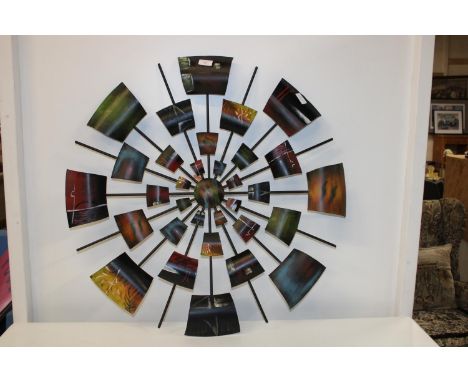 A piece of metal wall art collection only 82cm in diameter 
