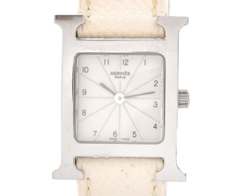 Hermes Stainless Steel H MM Watch With white leather strap and white dial. Model HH1.210. Quartz movement. Original box. Sign