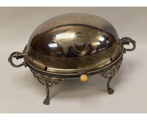 ELKINGTON BREAKFAST WARMER in EPNS with visor lid bearing ivory button handle, raised on four lion-feet and with engraved cre
