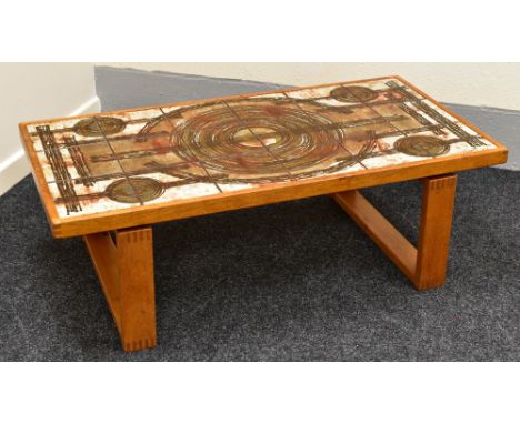 A DANISH 1970s TEAK COFFEE TABLE with abstract tile-top signed Ox Art and dated 1978, raised on open dovetail rectangular sup