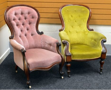 TWO LATE VICTORIAN BUTTON-BACK OPEN ARMCHAIRS both with mahogany frames and with curved backs and supports on castors