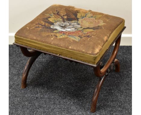A VICTORIAN MAHOGANY FOOTSTOOL having a floral sequined and tapestry top (worn) and on x-shaped supports with turned stretche
