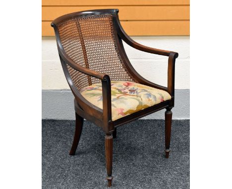 TURN OF THE CENTURY CANE-WORK OPEN ARMCHAIR with tapestry cushioned seat