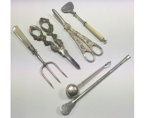 A set of plated grape shears, cast with vine;  another set;  a tasting fork;  a set of F.F. patent tongs/servers;  a silver t