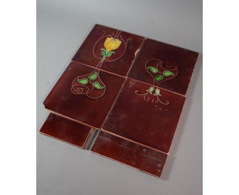A Collection of Four Red Glazed Tube Lined Decorated Tiles with Art Nouveau Style Tulip and Floral Decoration 