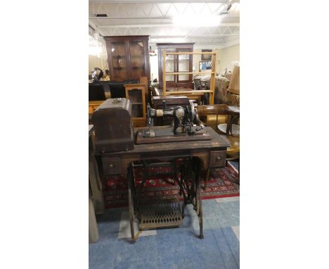 A Vintage Jones Treadle Sewing Machine with Cottons and Accessories 