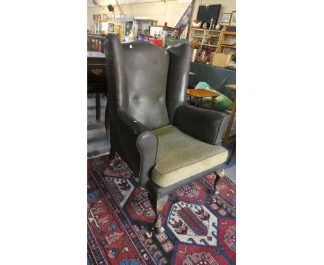 A Vintage Leather Effect Wing Armchair 