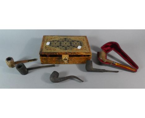 A Box Containing Four Vintage Pipes and a Cased Example with Amber Mouthpiece 