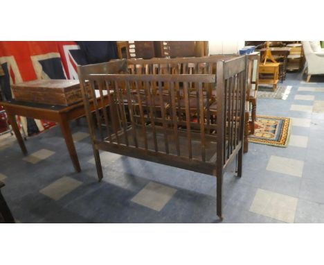 A Vintage Oak Childs Cot with Transfer Decoration 121cm Wide 