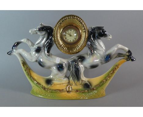 A Mid 20th Century Italian Ceramic Mantle Clock Decorated with Two Rearing Stallions, 49cm Wide 