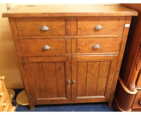 A 20th century "Irish Coast" stained teak drinks cabinet with hinged top over single drawer over cabinet door alongside cabin