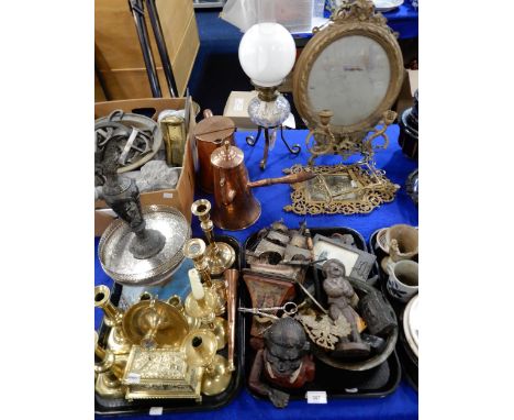 A gilt gesso mirror, a gilt metal mirror, a brass frame, a metal figural door stop, an oil lamp, snuff boxes, brass and coppe