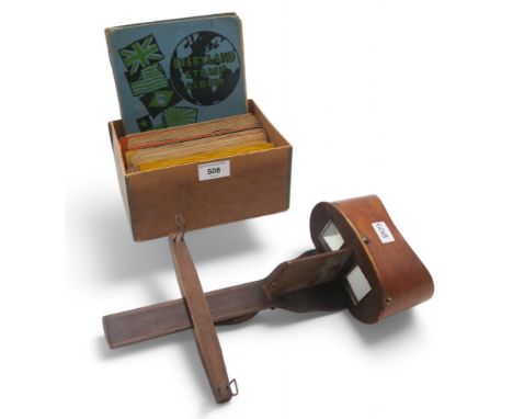 A stereoscopic slide viewer, with an assortment of slides, to include a series of macabre coloured satanic scenes, a view of 