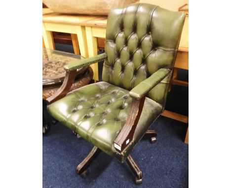 A 20th century oak green leather button back upholstered swivel desk chair, 96cm high&nbsp; Condition Report:Available upon r