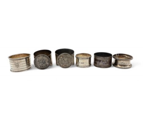 Two white metal napkin rings set with 9 Decimos, together with four silver napkin rings, 95gms (6) Condition Report:Available