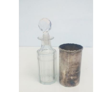 Small glass decanter in silver sleave 