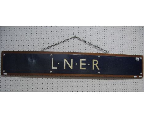 A L.N.E.R Blue Enamel Railway Sign, 109cm long, 15cm high, mounted on a wooden board, 112cm long, 18cm high.