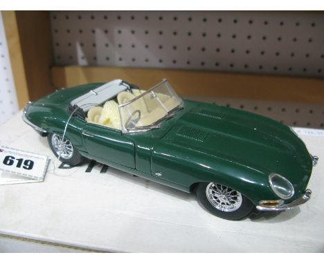 A Boxed Franklin Mint 1:24th Scale Diecast Model 1961 Jaguar E-Type, accompanied by literature.