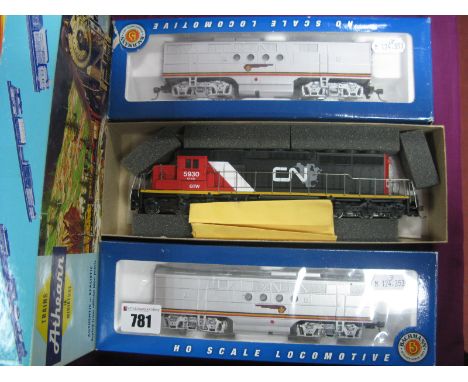 An Athearn "HO" Gauge Outline Canadian SD40-2 Locomotive R/No 5930 CN NAFTA,  together with two BachmanN "HO" gauge #11802 EM