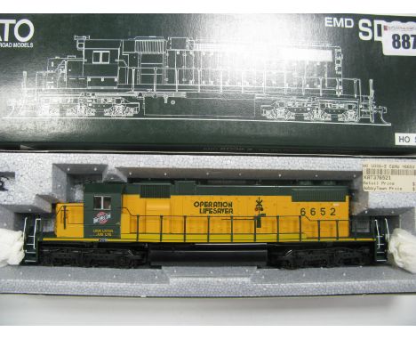 A Kato (Japan) "HO" Gauge #37-6521 Outline American EMD SD38-2 Operation Lifesaver Chicago North Western, R/No. 6652, orange 