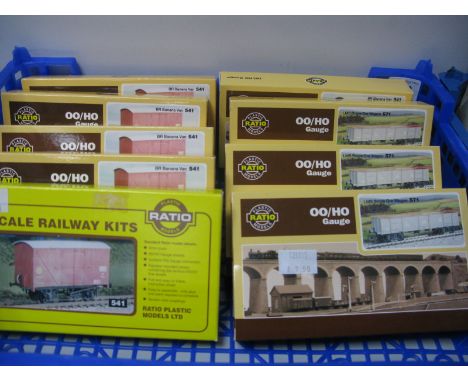 Nine 'OO' Scale Model Railway Kits by Ratio, five BR Banana vans and four LMS bogie ore, all boxed, unopened.