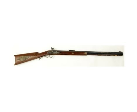 Black Powder Italian "The Hawken" CAL. 54 Single Shot Rifle. Serial number 036555. Octagon barrel, mounted brass along the ha