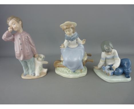 Three Nao porcelain figurines of young children