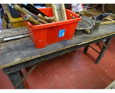 Old garage workshop bench with fitted vice and a red tub of hand tools, vintage blow lamp etc