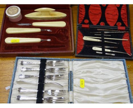 Two vintage cased part manicure sets and a boxed set of EP cake forks