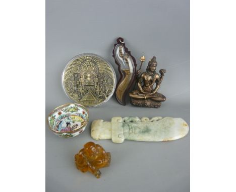 Cast roundel titled 'Maya', an amber type figure of a seated man, a carved possibly jade knife ornament, one other in Tibetan